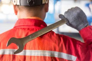 automechanic-overalls-holding-wrench-spanner