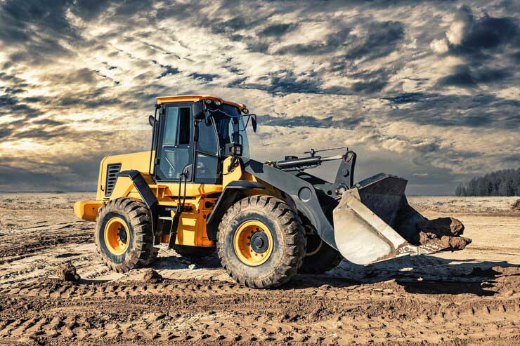 powerful-bulldozer-loader-moves-earth-construction-site-against-sky-earthmoving-machine-is-leveling-site-construction-heavy-equipment-earthworks